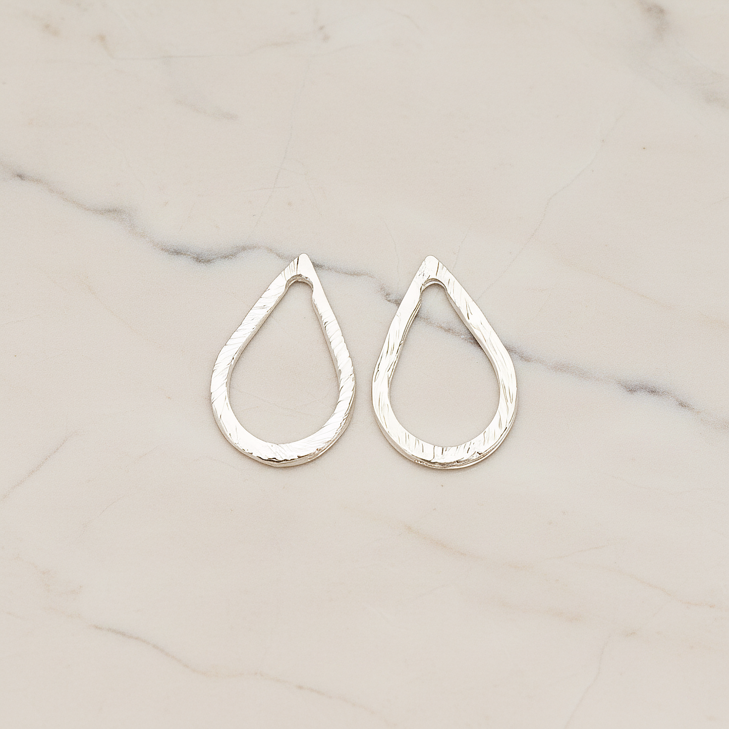 Slash Textured Teardrop Small Link Pendant, 2 Pc on warm marble background (PD.1624-01)