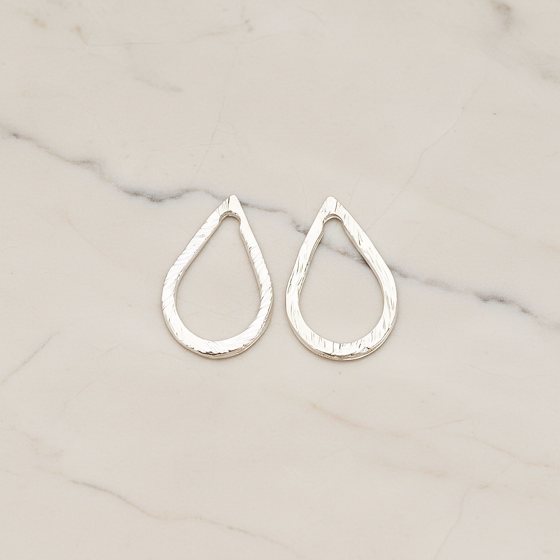 Slash Textured Teardrop Small Link Pendant, 2 Pc on warm marble background (PD.1624-01)