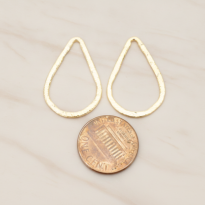 Slash Textured Teardrop Medium Link Pendant, 2 Pc on warm marble background (PD.1624-02)