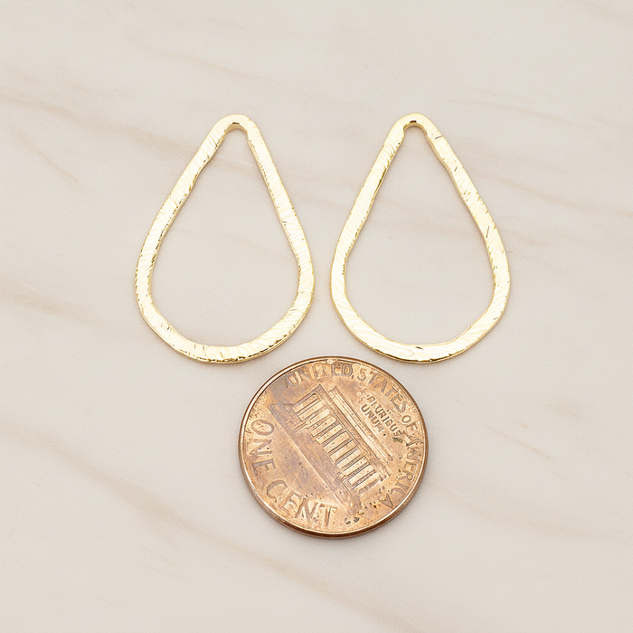 Slash Textured Teardrop Medium Link Pendant, 2 Pc on warm marble background (PD.1624-02)
