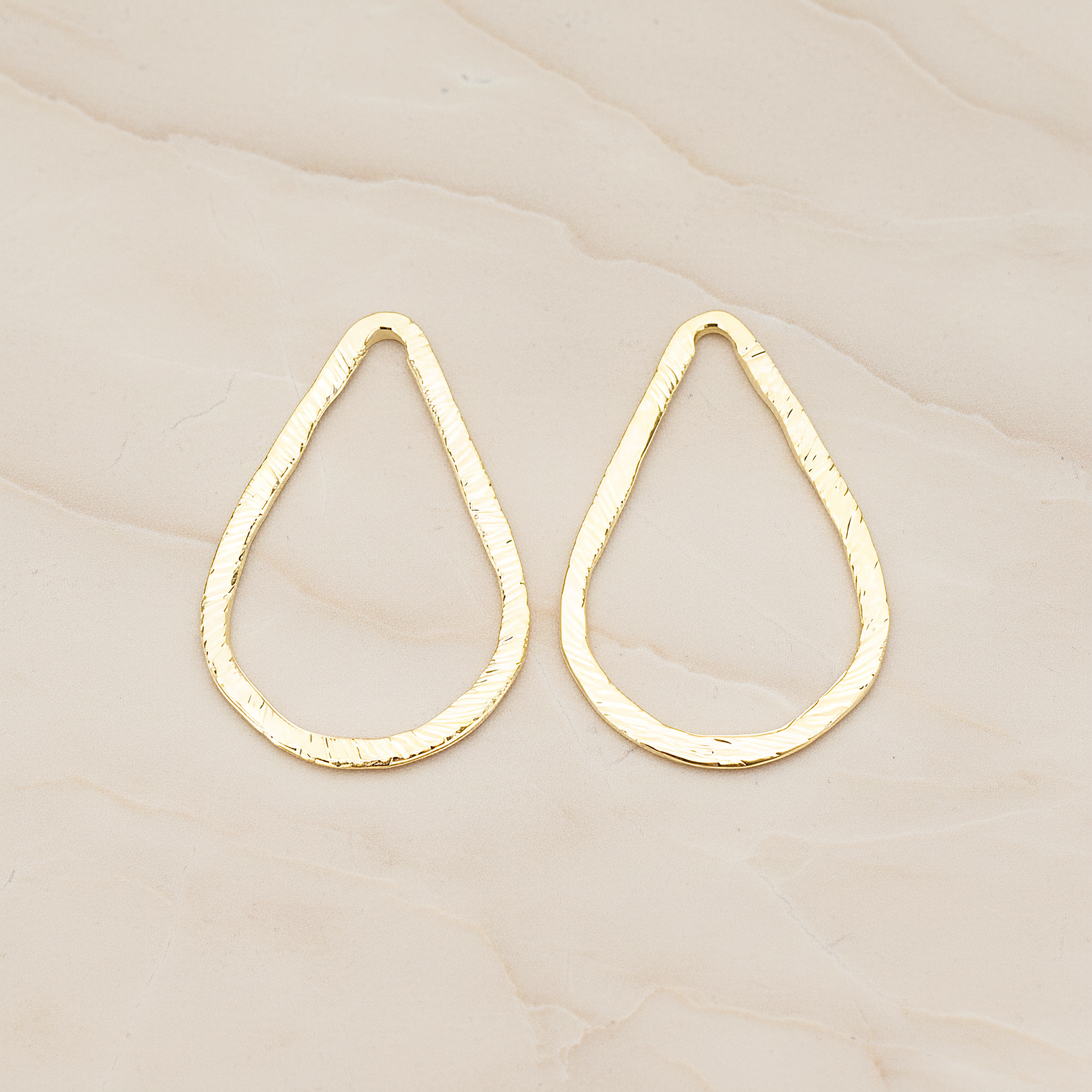 Slash Textured Teardrop Medium Link Pendant, 2 Pc on warm marble background (PD.1624-02)
