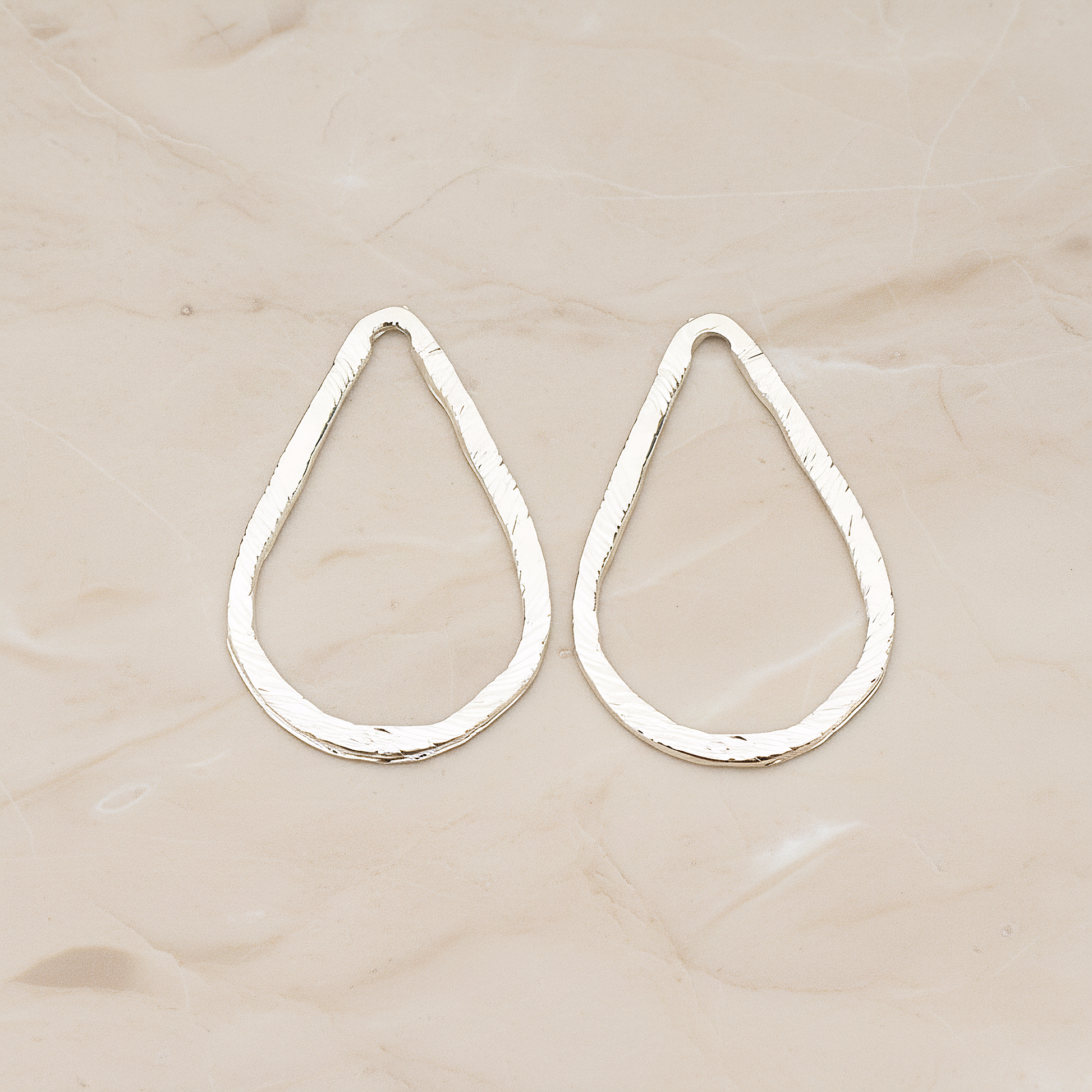 Slash Textured Teardrop Medium Link Pendant, 2 Pc on warm marble background (PD.1624-02)