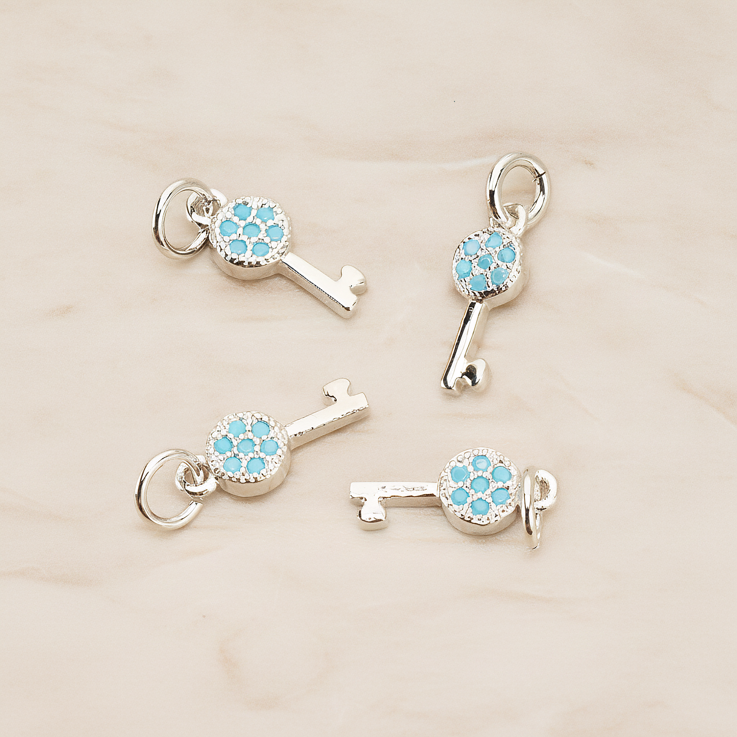 Mint Cubic Zirconia Setting Key Pendant, 1 Pc on warm marble background (PD.1699)