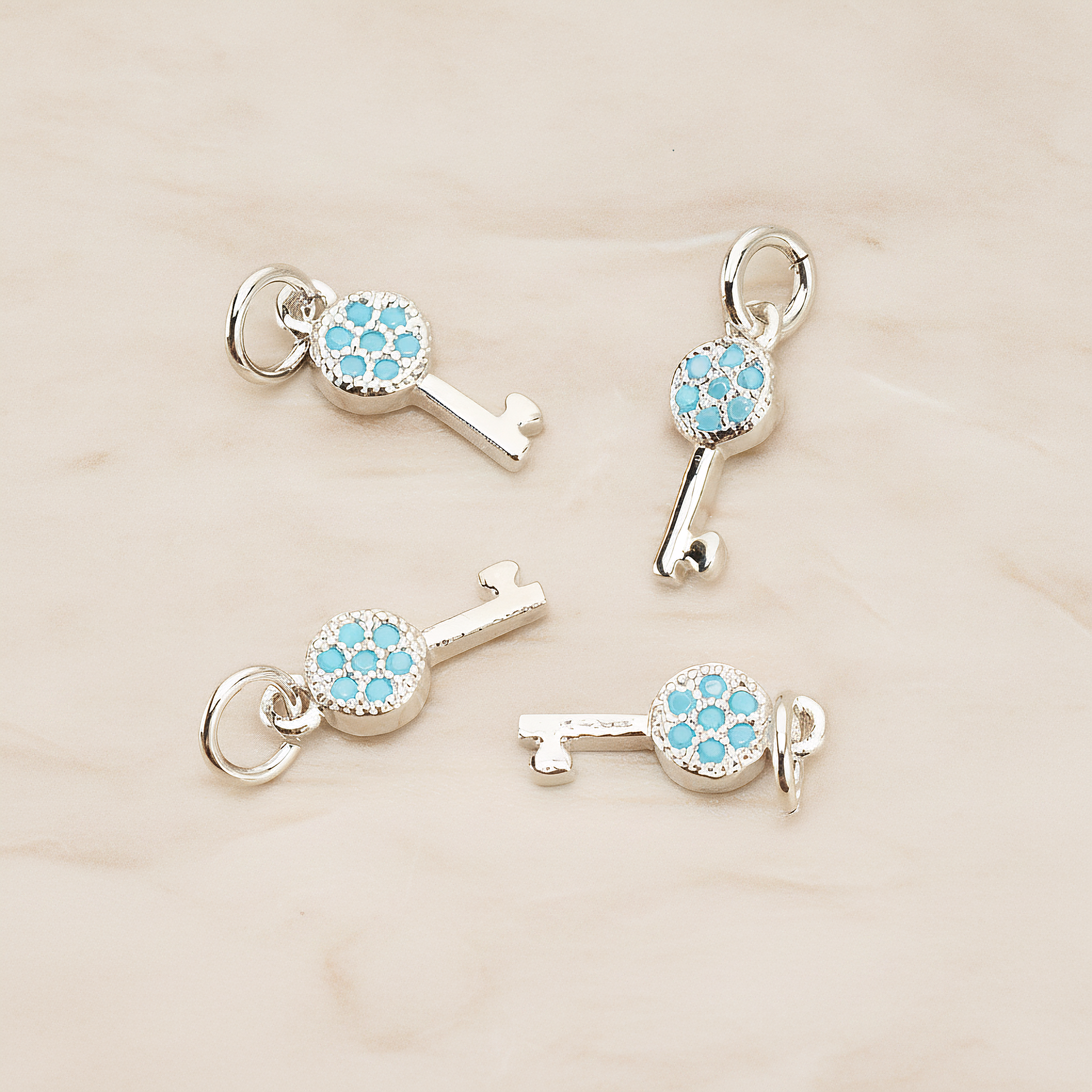 Mint Cubic Zirconia Setting Key Pendant, 1 Pc on warm marble background (PD.1699)