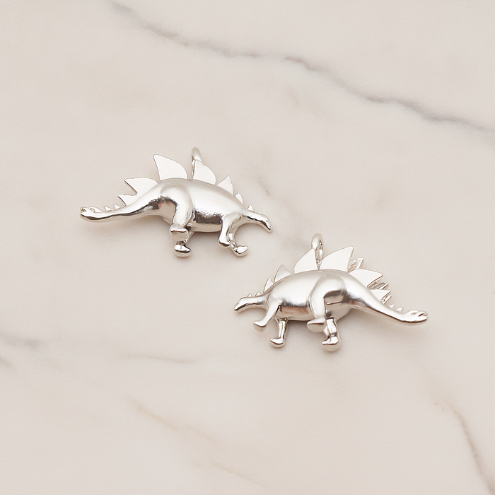 Stegosaurus, Dinosaur Pendant, 2 Pc on warm marble background (PD.1797)