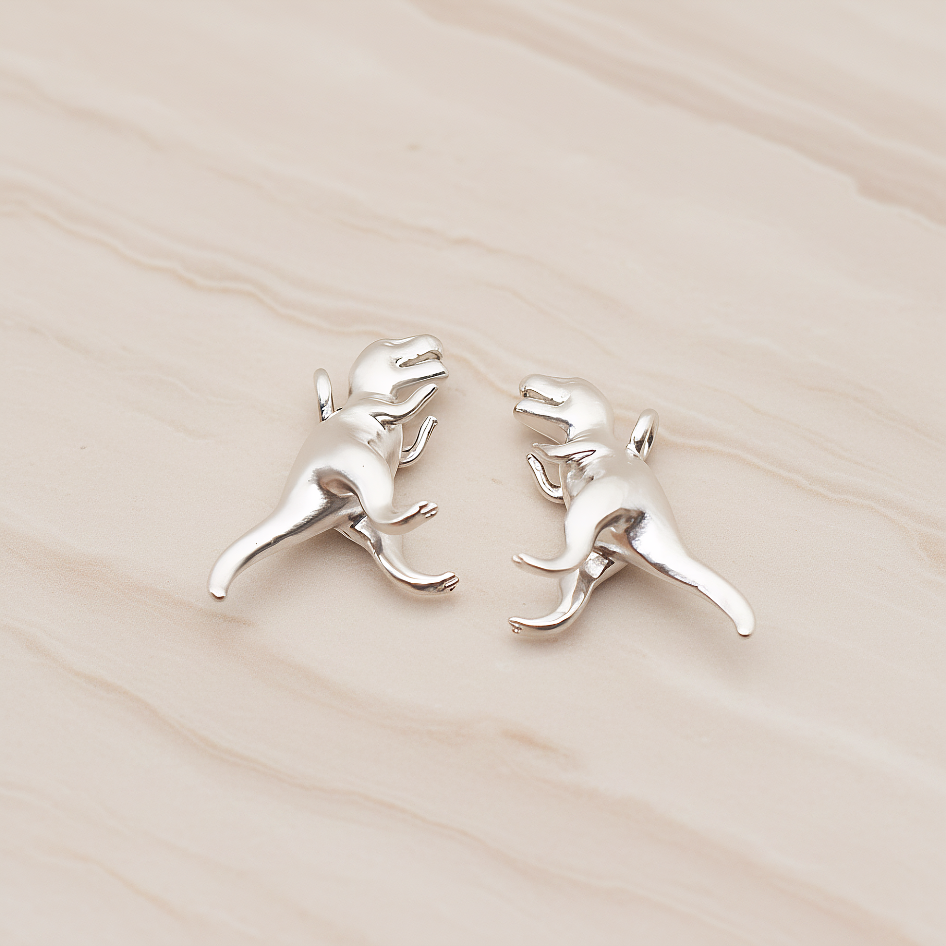 Tyrannosaurus, Dinosaur Pendant, 2 Pc on warm marble background (PD.1798)