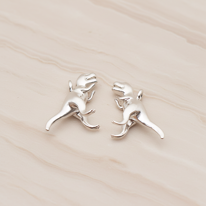 Tyrannosaurus, Dinosaur Pendant, 2 Pc on warm marble background (PD.1798)