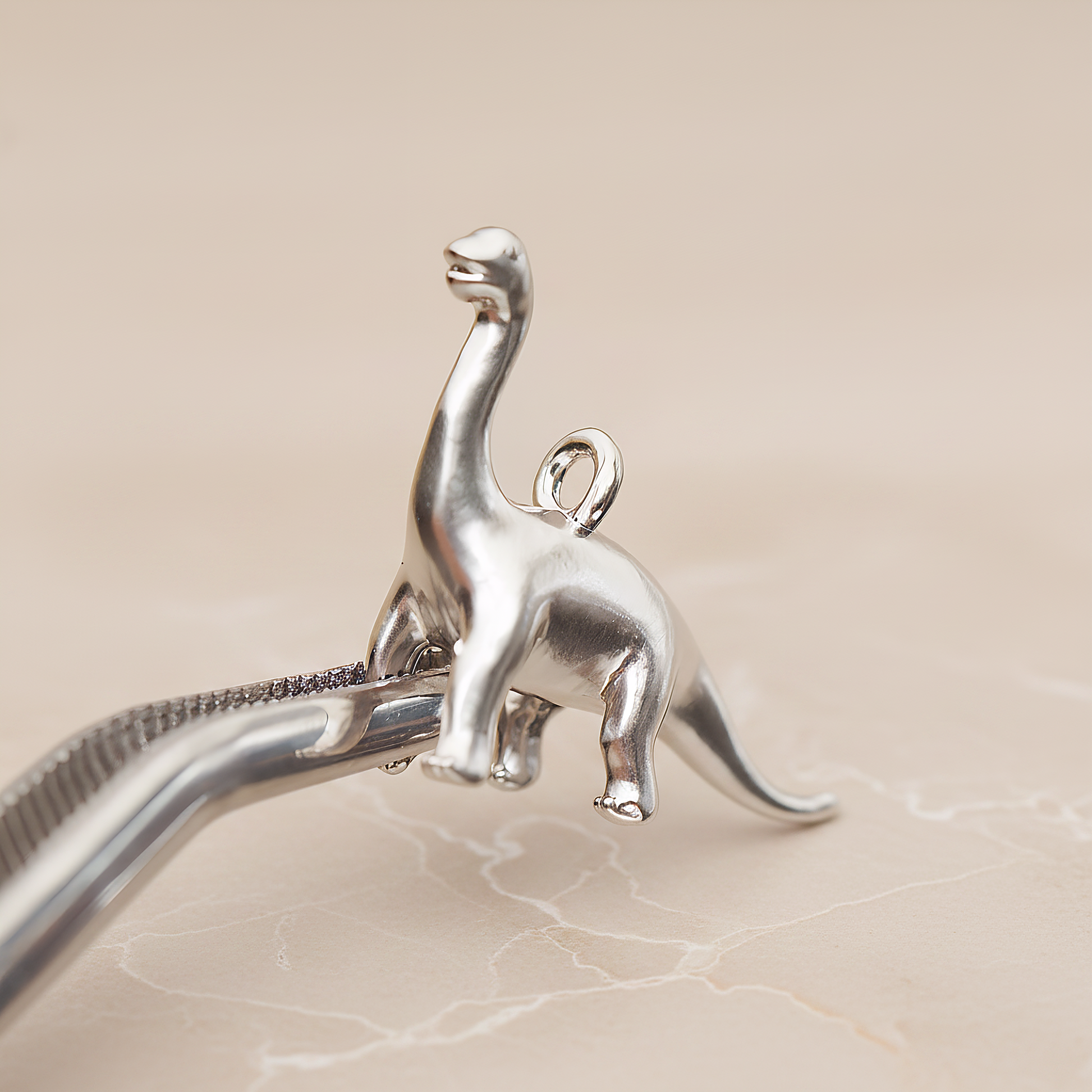 Brachiosaurus, Dinosaur Pendant, 2 Pc on warm marble background (PD.1799)