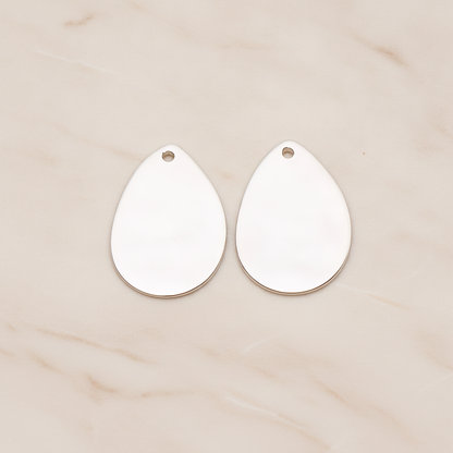 Small Teardrop Stamped Hammered Pendant, 2 Pc on warm marble background (PD.1826-01)
