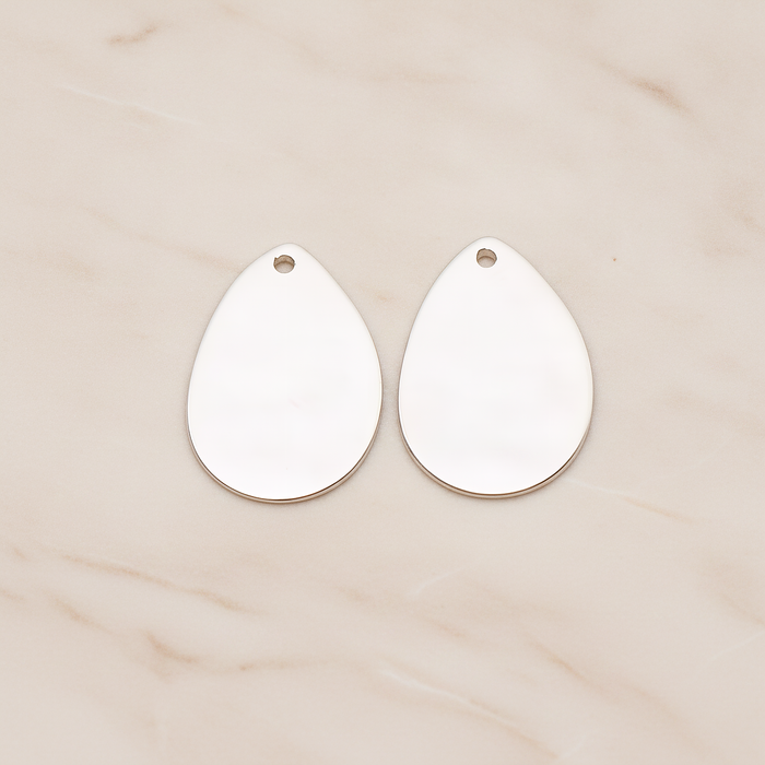 Small Teardrop Stamped Hammered Pendant, 2 Pc on warm marble background (PD.1826-01)