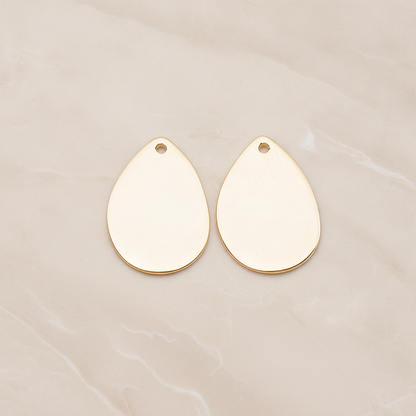 Small Teardrop Stamped Hammered Pendant, 2 Pc on warm marble background (PD.1826-01)