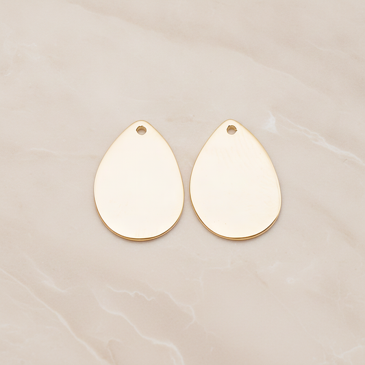 Small Teardrop Stamped Hammered Pendant, 2 Pc on warm marble background (PD.1826-01)