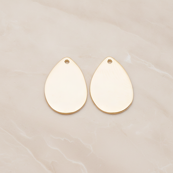 Small Teardrop Stamped Hammered Pendant, 2 Pc on warm marble background (PD.1826-01)