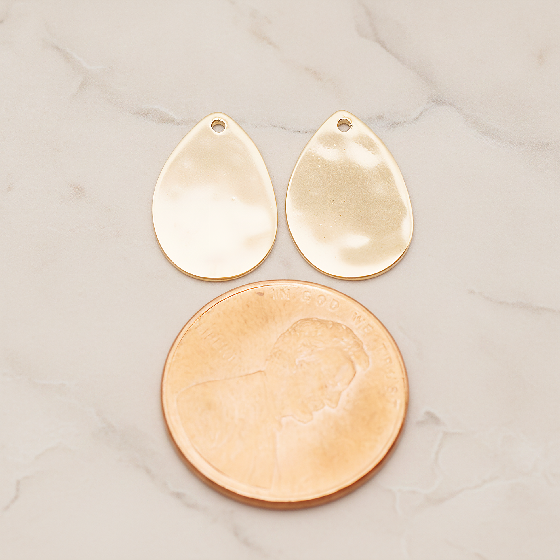 Small Teardrop Stamped Hammered Pendant, 2 Pc on warm marble background (PD.1826-01)
