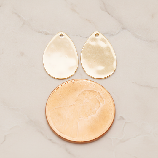 Small Teardrop Stamped Hammered Pendant, 2 Pc on warm marble background (PD.1826-01)