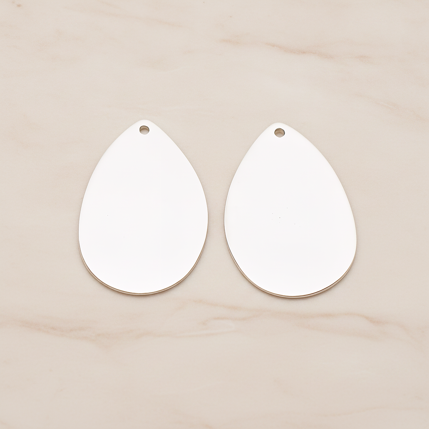 Large Teardrop Stamped Hammered Pendant, 2 Pc on warm marble background (PD.1826-02)