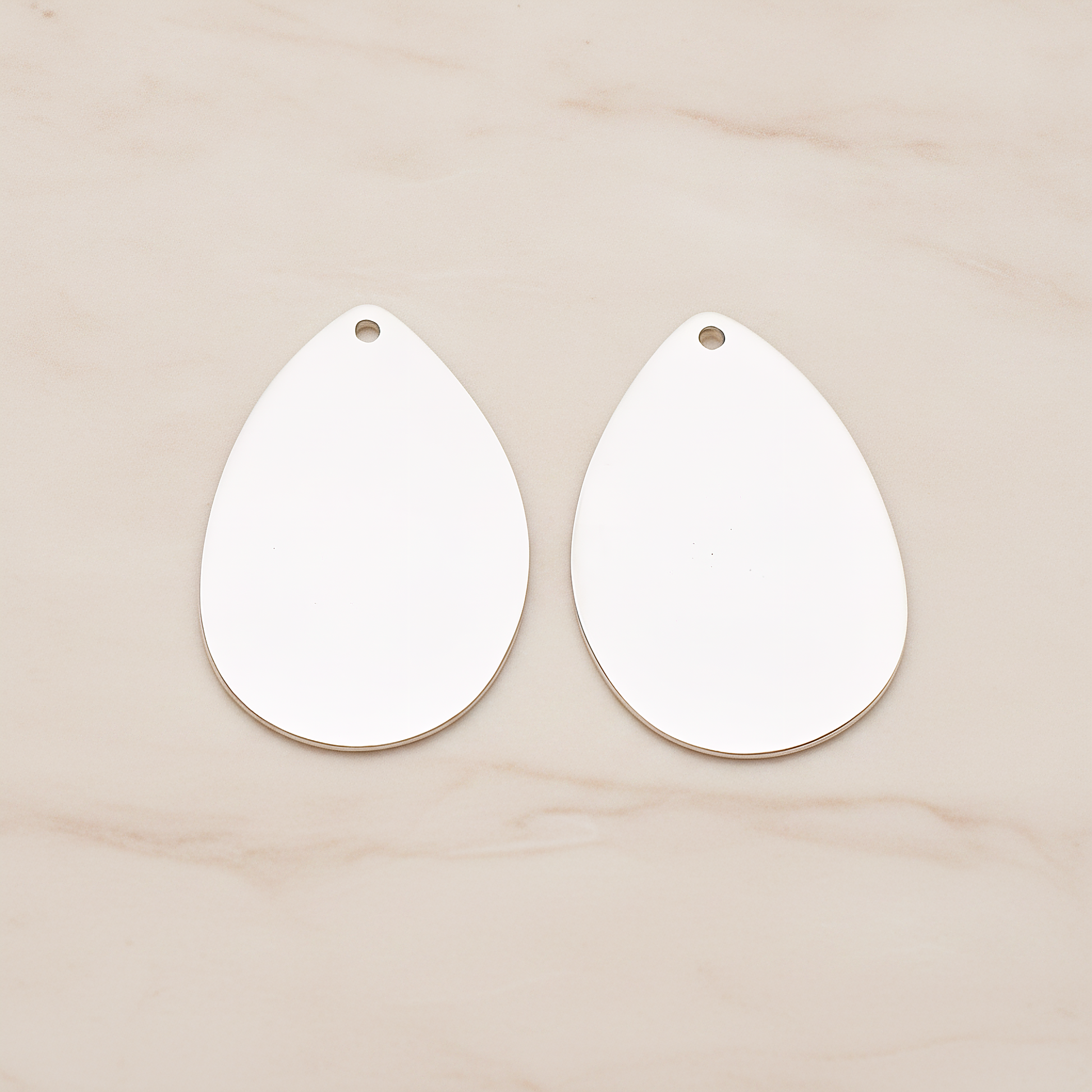 Large Teardrop Stamped Hammered Pendant, 2 Pc on warm marble background (PD.1826-02)