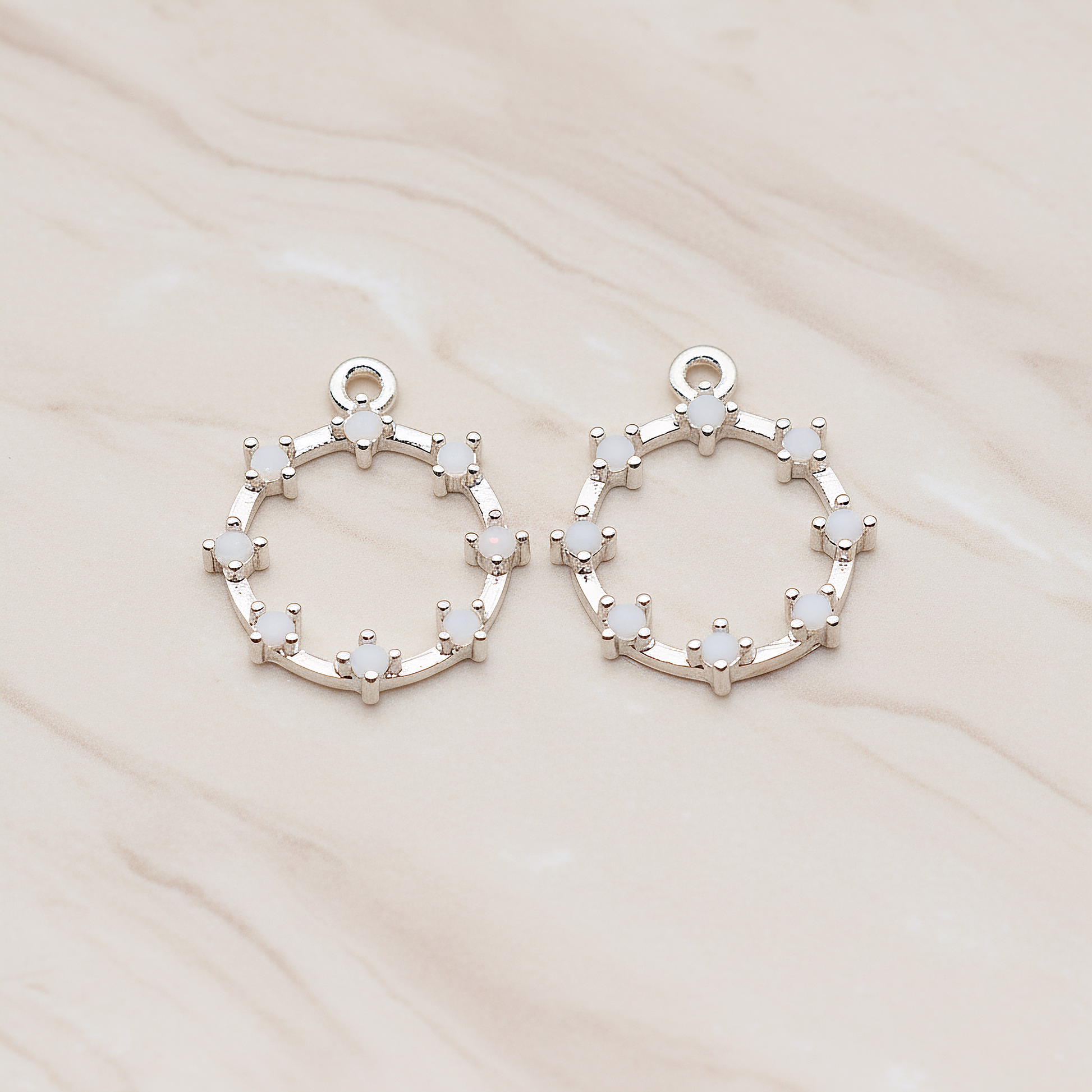 Crown of Beauty Round Cubic Pendant, 2 Pc on warm marble background (PD.1840)