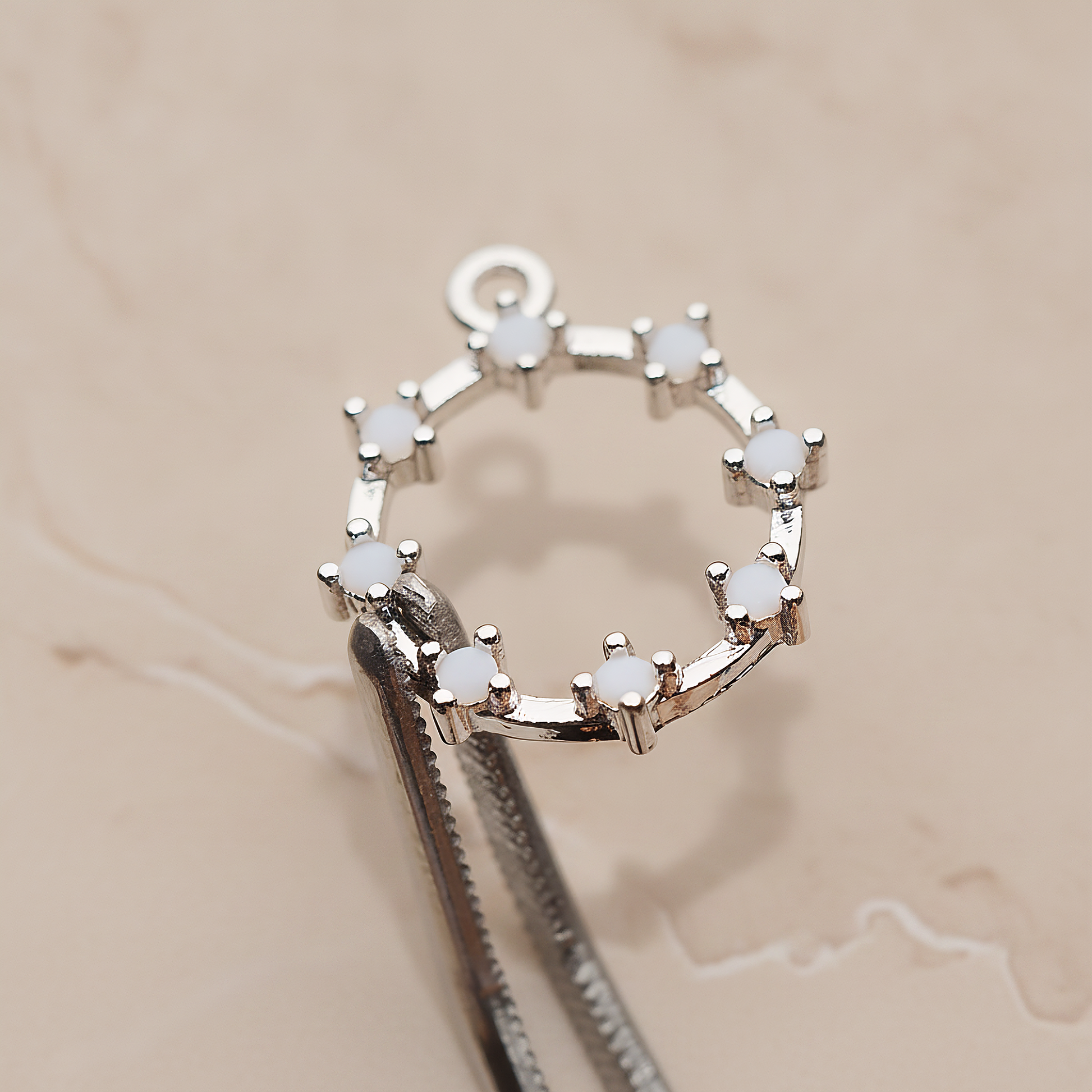 Crown of Beauty Round Cubic Pendant, 2 Pc on warm marble background (PD.1840)