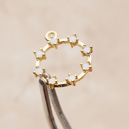 Crown of Beauty Round Cubic Pendant, 2 Pc on warm marble background (PD.1840)