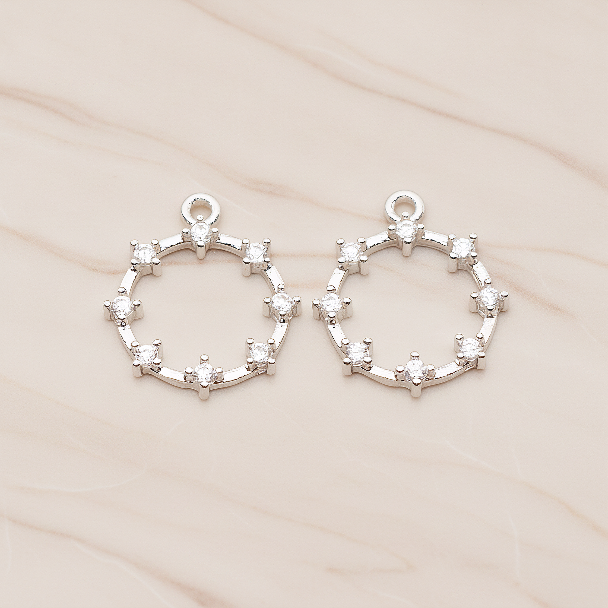 Crown of Beauty Round Cubic Pendant, 2 Pc on warm marble background (PD.1840)