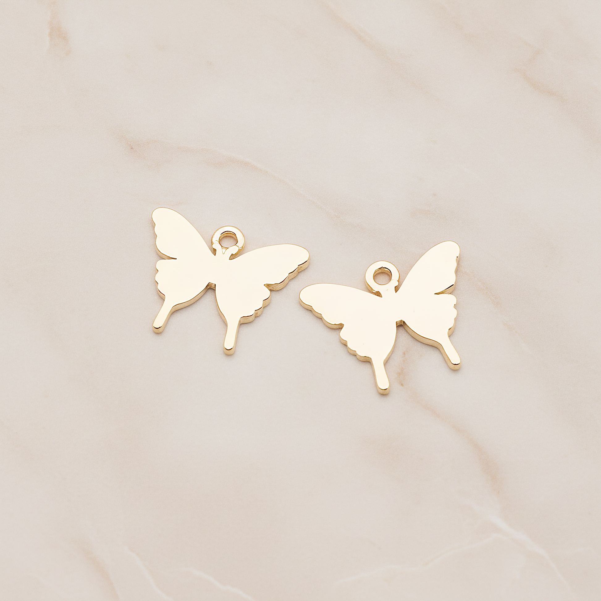 Simple Flat Butterfly Pendant, 2 Pc on warm marble background (PD.1880)