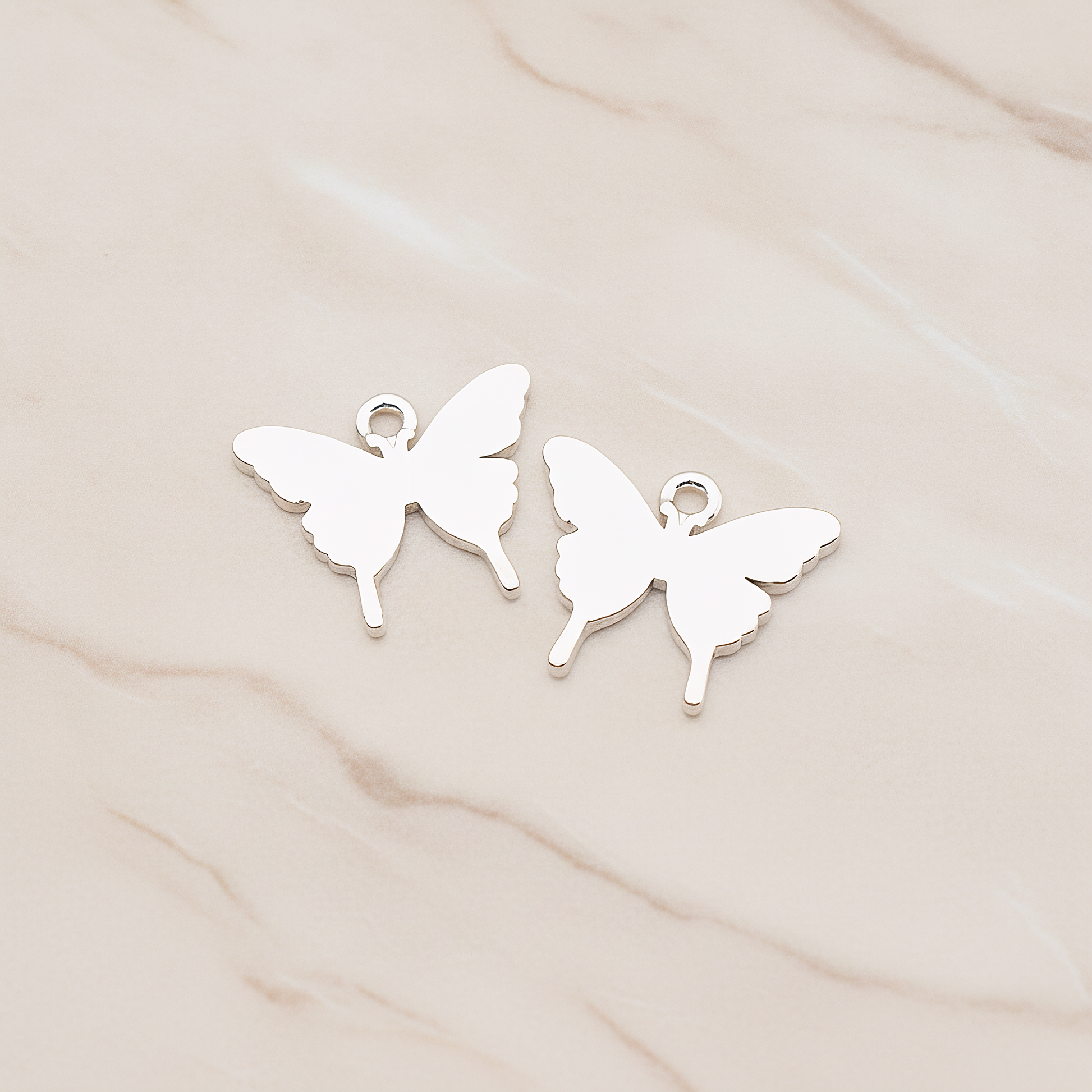 Simple Flat Butterfly Pendant, 2 Pc on warm marble background (PD.1880)