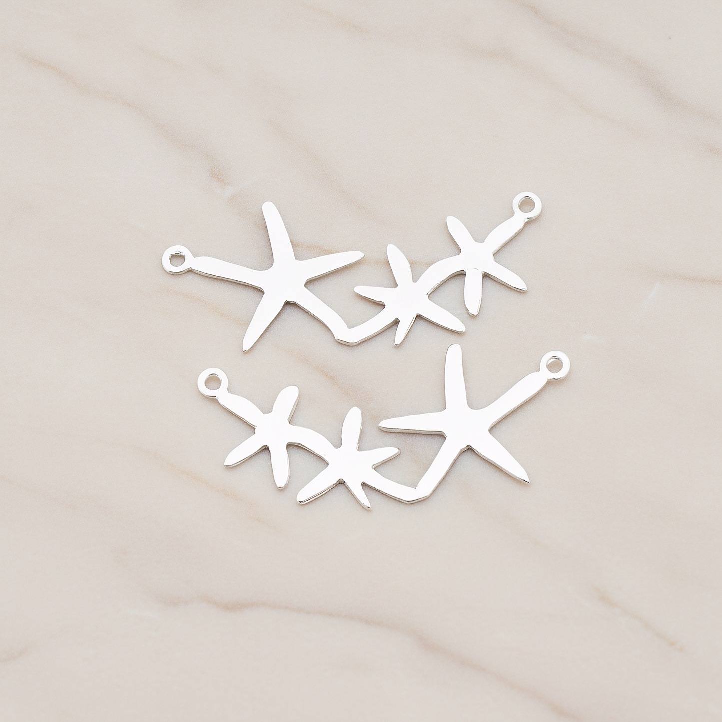 Triple Starfish Linked Pendant, 2 Pc on warm marble background (PD.189)