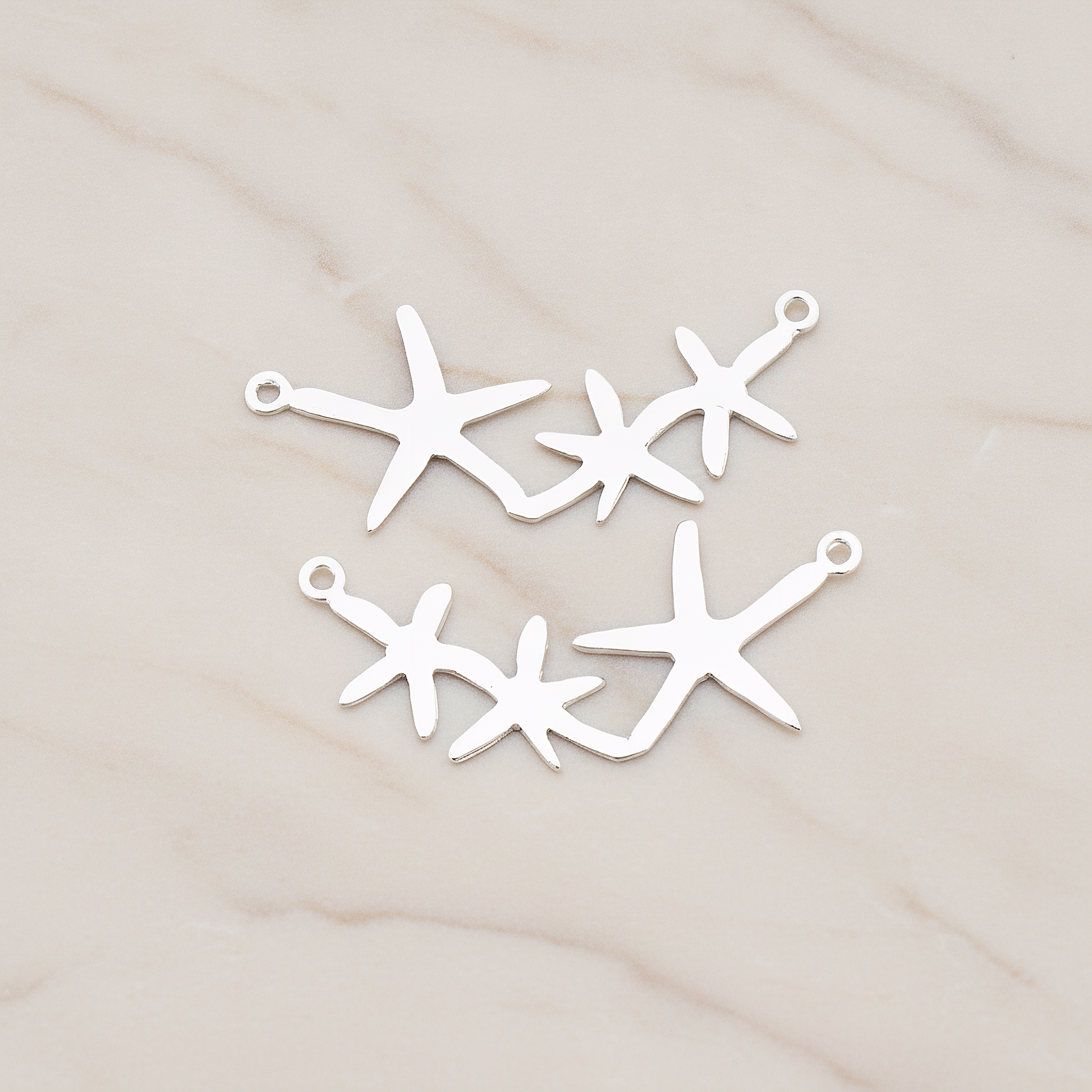 Triple Starfish Linked Pendant, 2 Pc on warm marble background (PD.189)