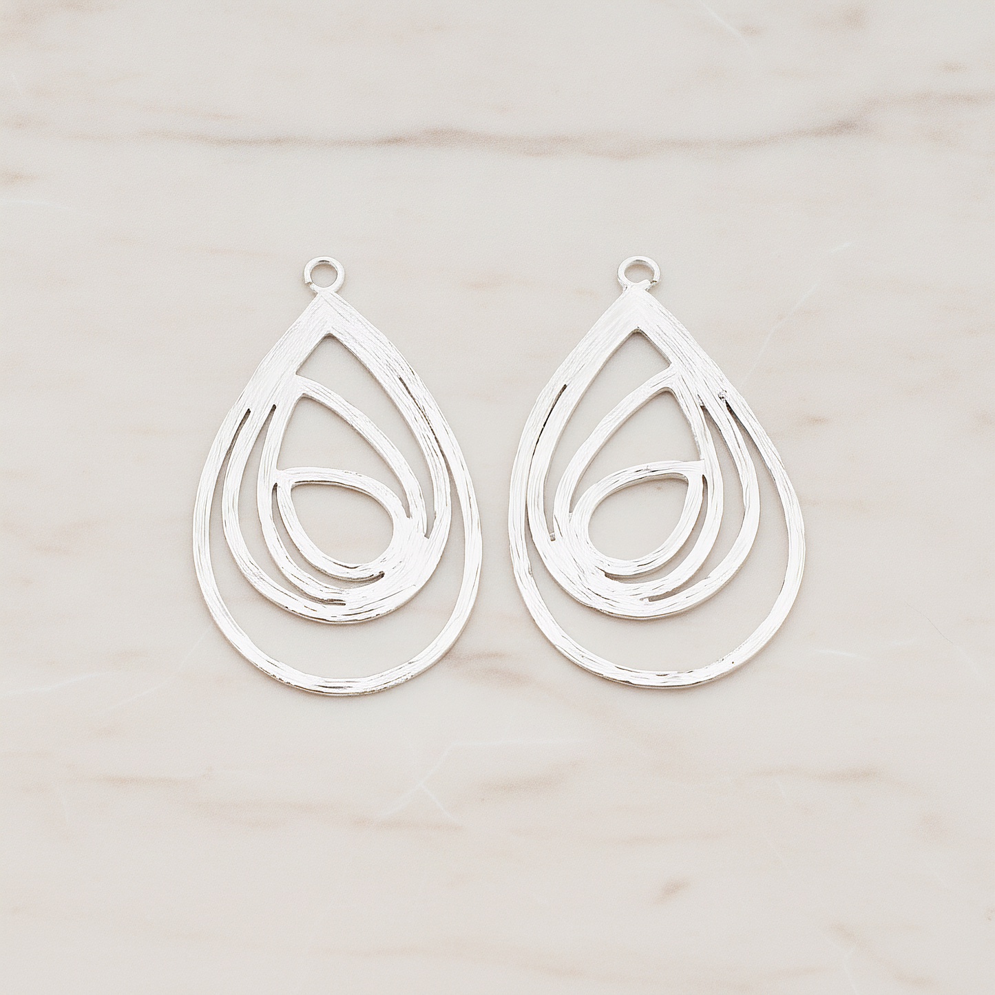 Multiple Teardrop Pendant, 2 Pc on warm marble background (PD.190)