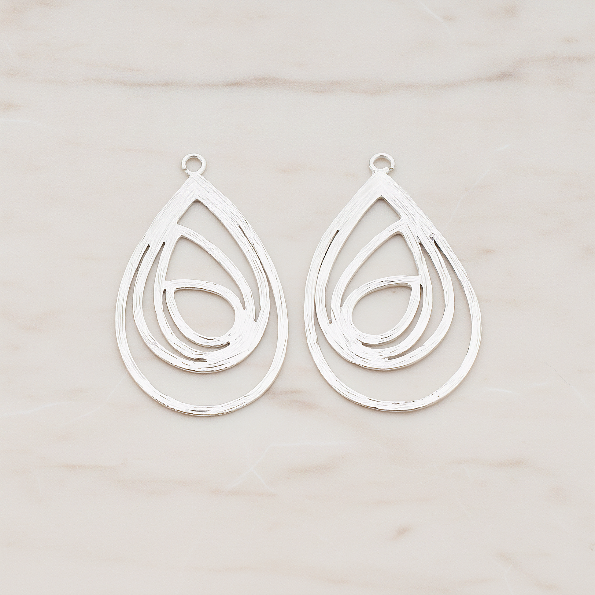 Multiple Teardrop Pendant, 2 Pc on warm marble background (PD.190)
