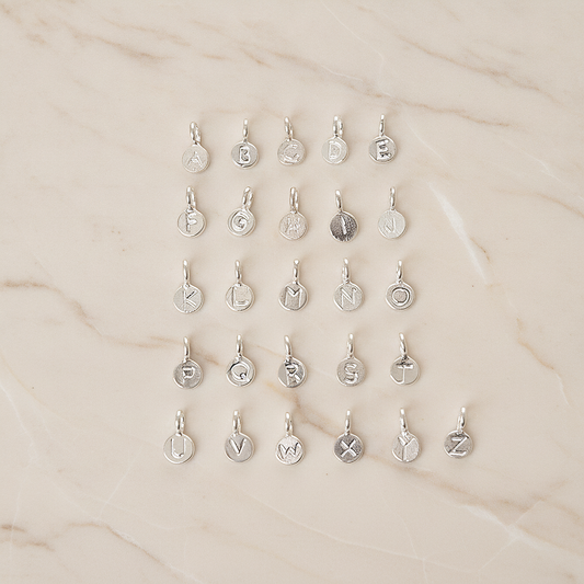 925 Silver Small Round Initials Pendant, 1 Pc on warm marble background (PD.1940)