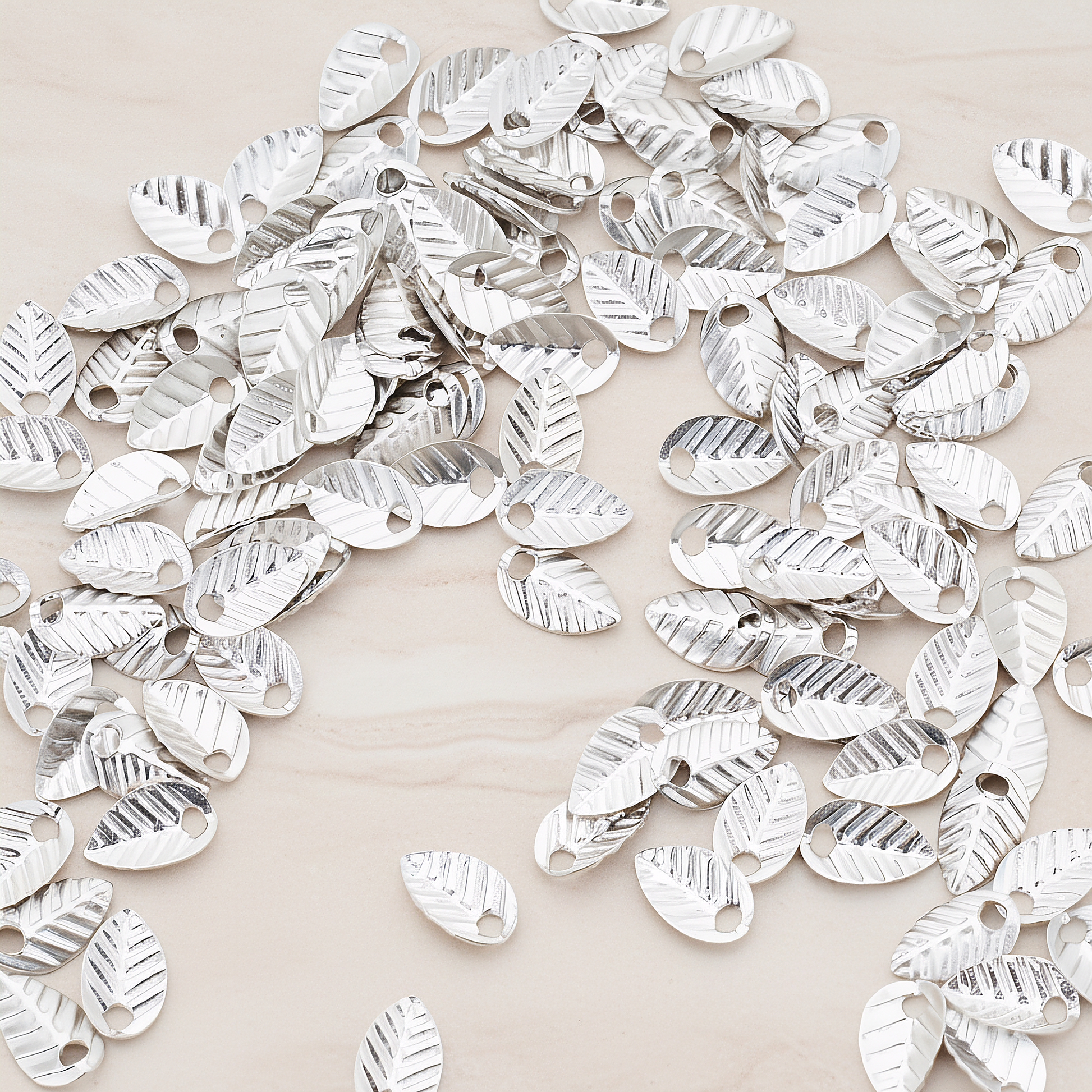 Half Fold Tiny Leaf Charm, 20 Pc on warm marble background (PD.222)