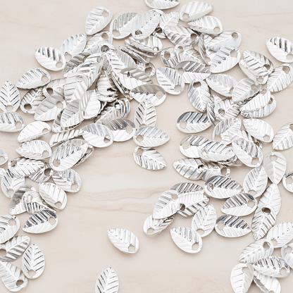 Half Fold Tiny Leaf Charm, 20 Pc on warm marble background (PD.222)
