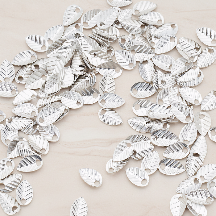 Half Fold Tiny Leaf Charm, 20 Pc on warm marble background (PD.222)