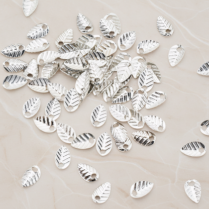 Half Fold Tiny Leaf Charm, 20 Pc on warm marble background (PD.222)