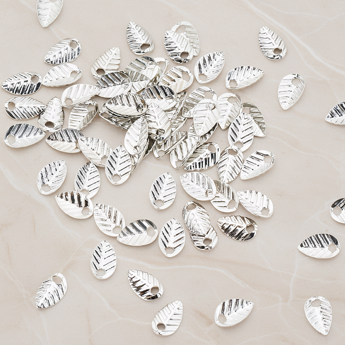 Half Fold Tiny Leaf Charm, 20 Pc on warm marble background (PD.222)