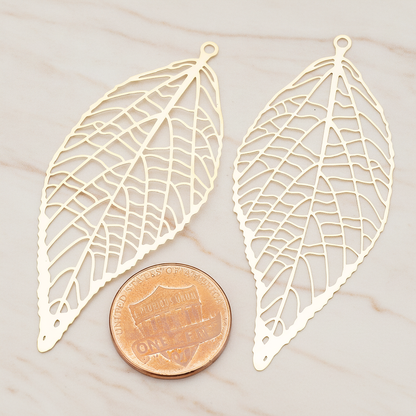 Pressed Filigree Vein Leaf Pendant,, 2 Pc on warm marble background (PD.243)