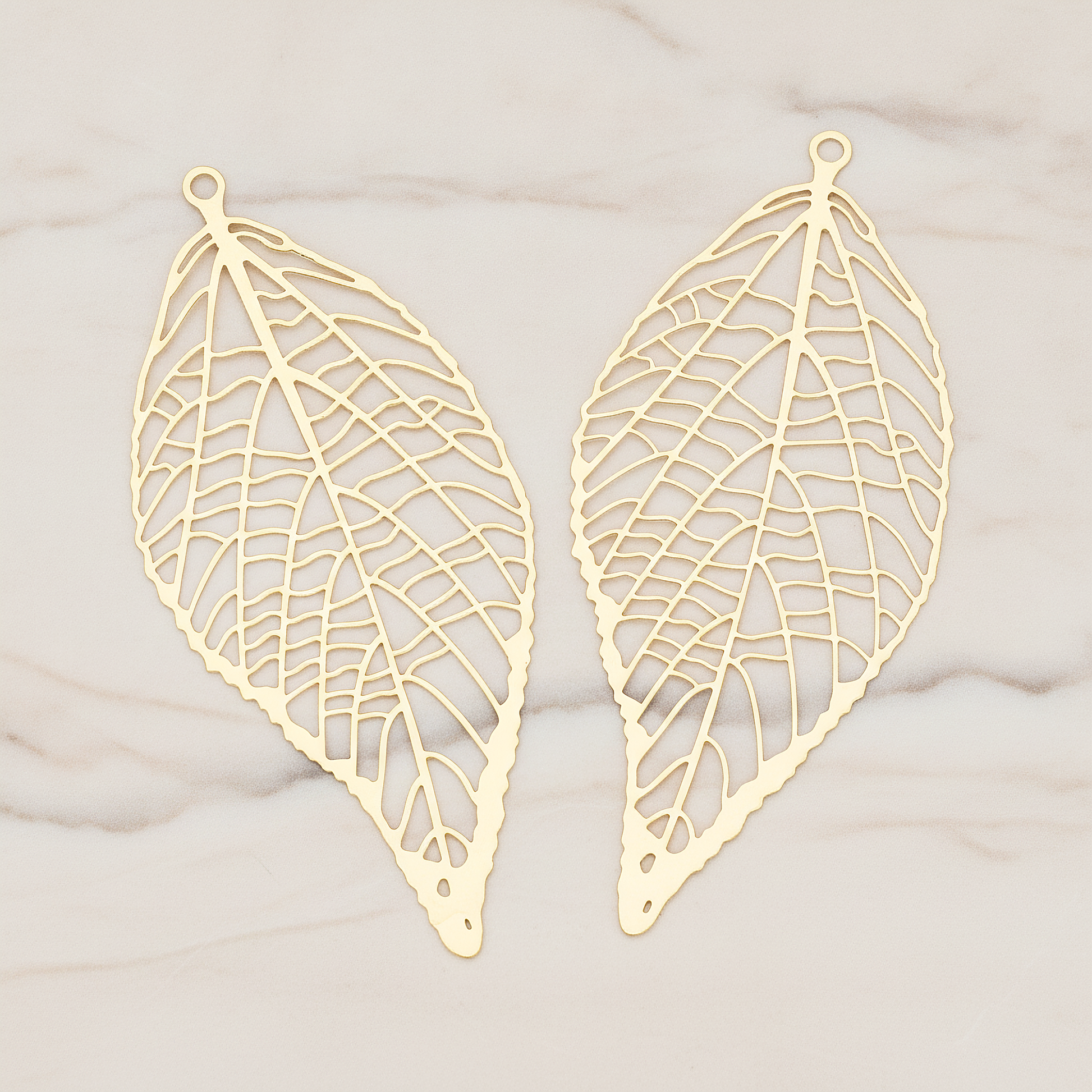 Pressed Filigree Vein Leaf Pendant,, 2 Pc on warm marble background (PD.243)