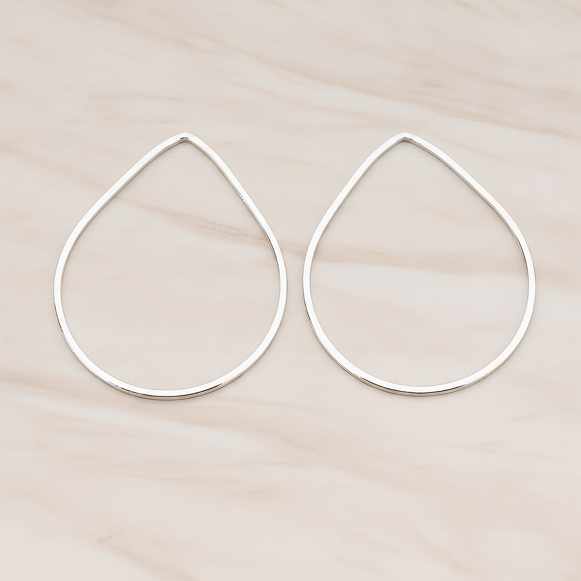 Simple Teardrop Link Pendant, 2 Pc on warm marble background (PD.300-01)