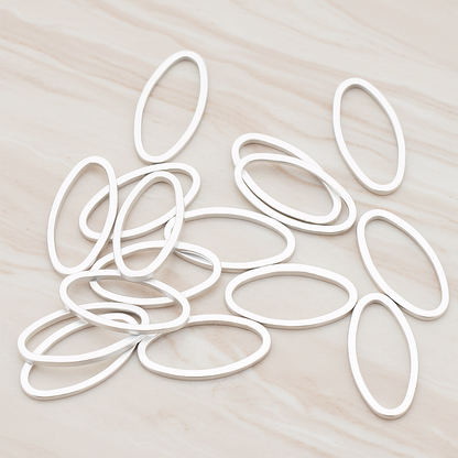 8 X 16 Mm Simple Oval Link Pendant, 4 Pc on warm marble background (PD.304-03)