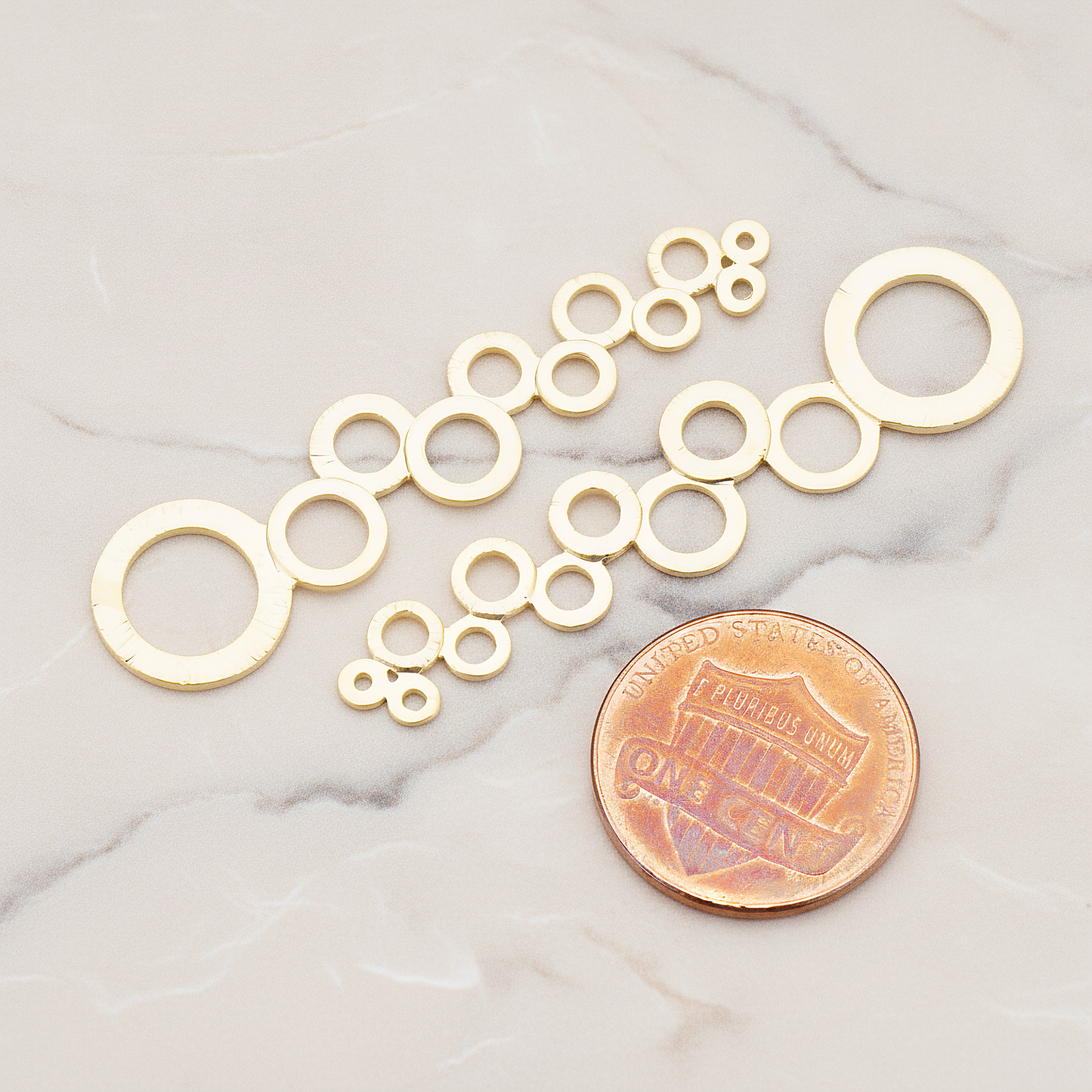 Brushed Multi Circle Stream Pendant, 2 Pc on warm marble background (PD.318-05)