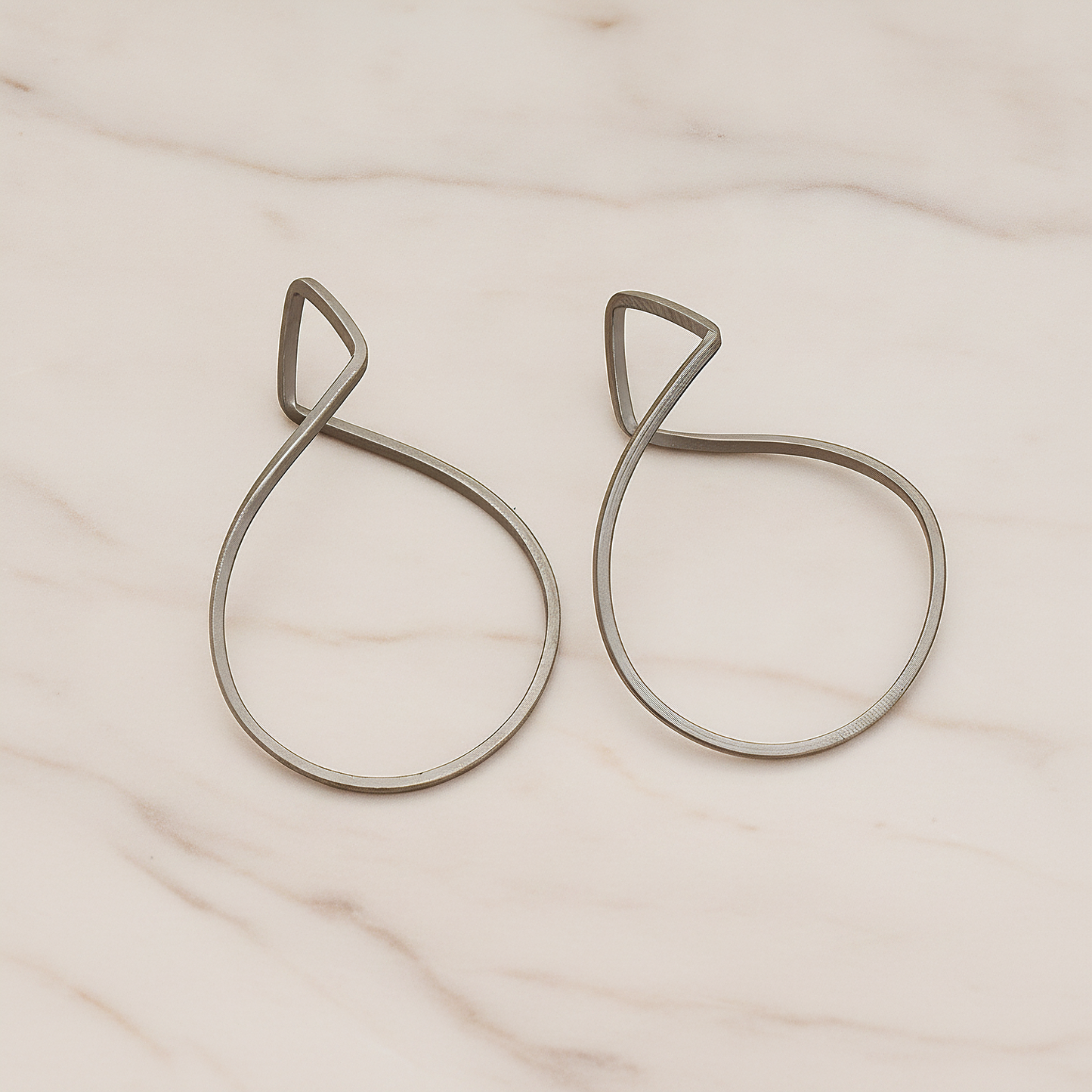 Simple Twisted Teardrop Pendant, 2 Pc on warm marble background (PD.322)