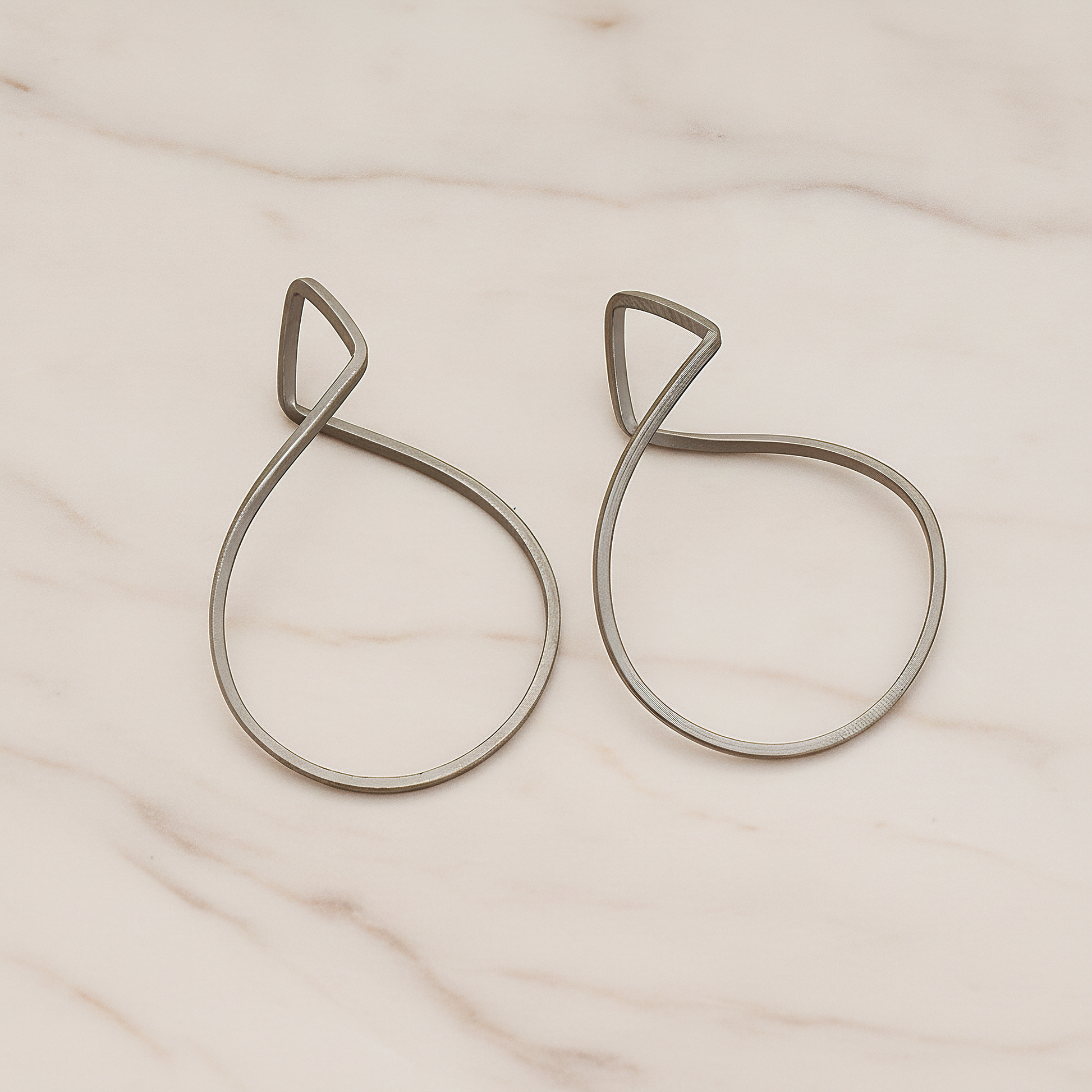 Simple Twisted Teardrop Pendant, 2 Pc on warm marble background (PD.322)