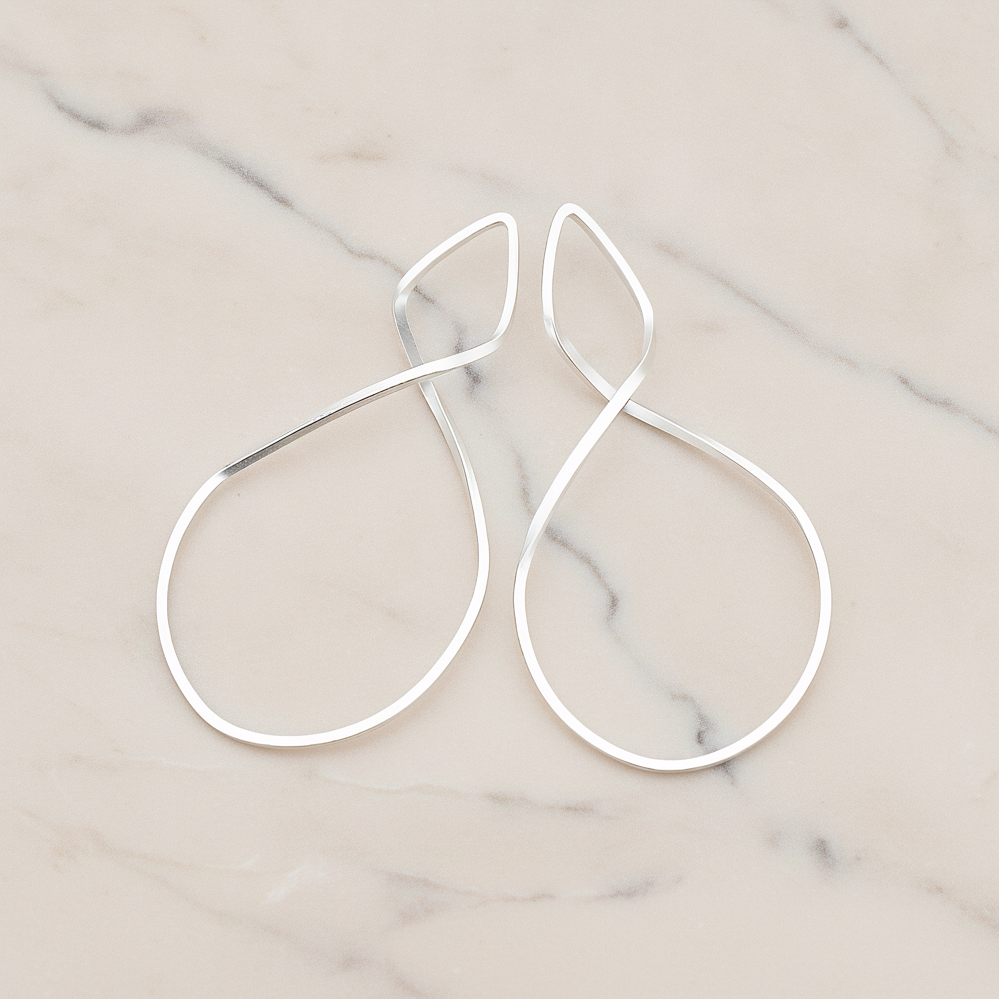 Simple Twisted Teardrop Pendant, 2 Pc on warm marble background (PD.322)