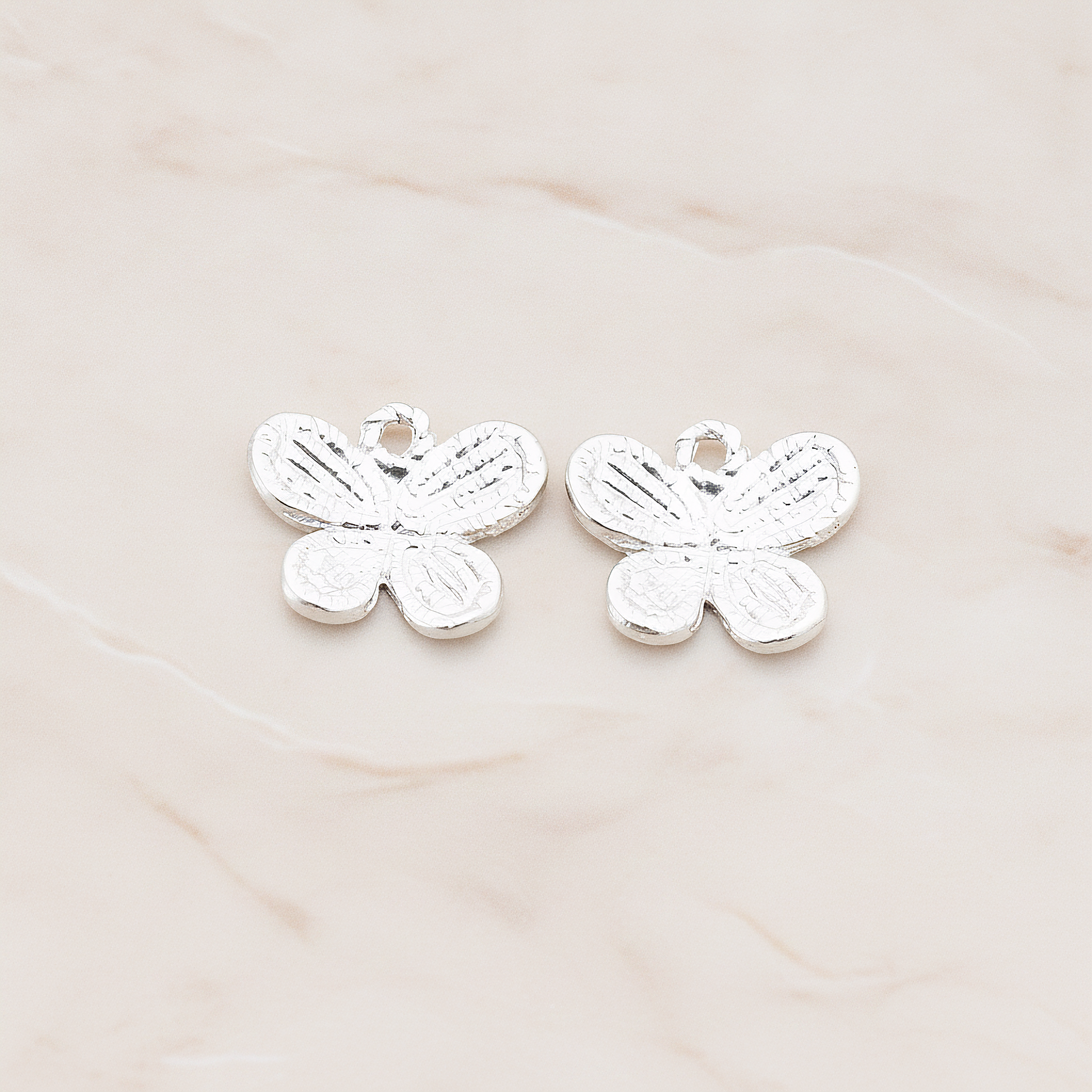 Four Petals Small Butterfly Shaped Pendant, 2 Pc on warm marble background (PD.379-02)