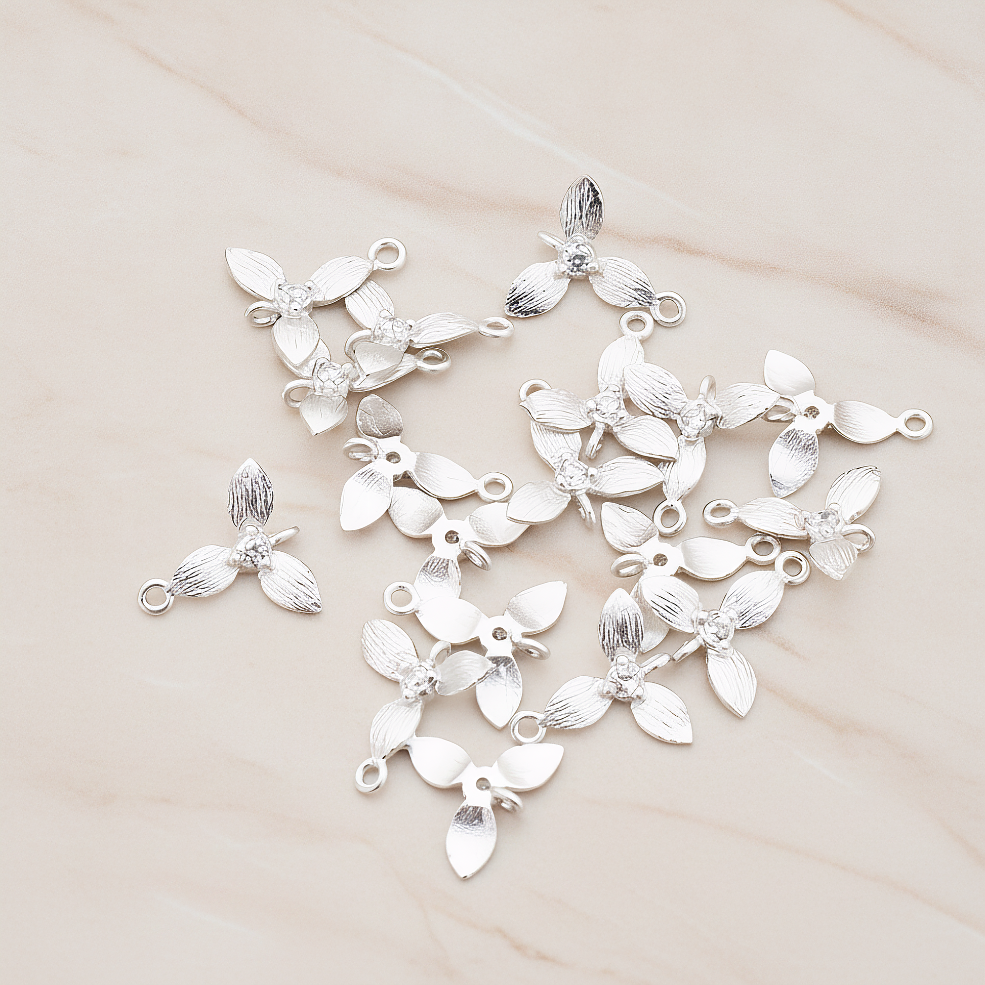 Cubic Zirconia Centered Flower Connector Pendant, 2 Pc on warm marble background (PD.429)