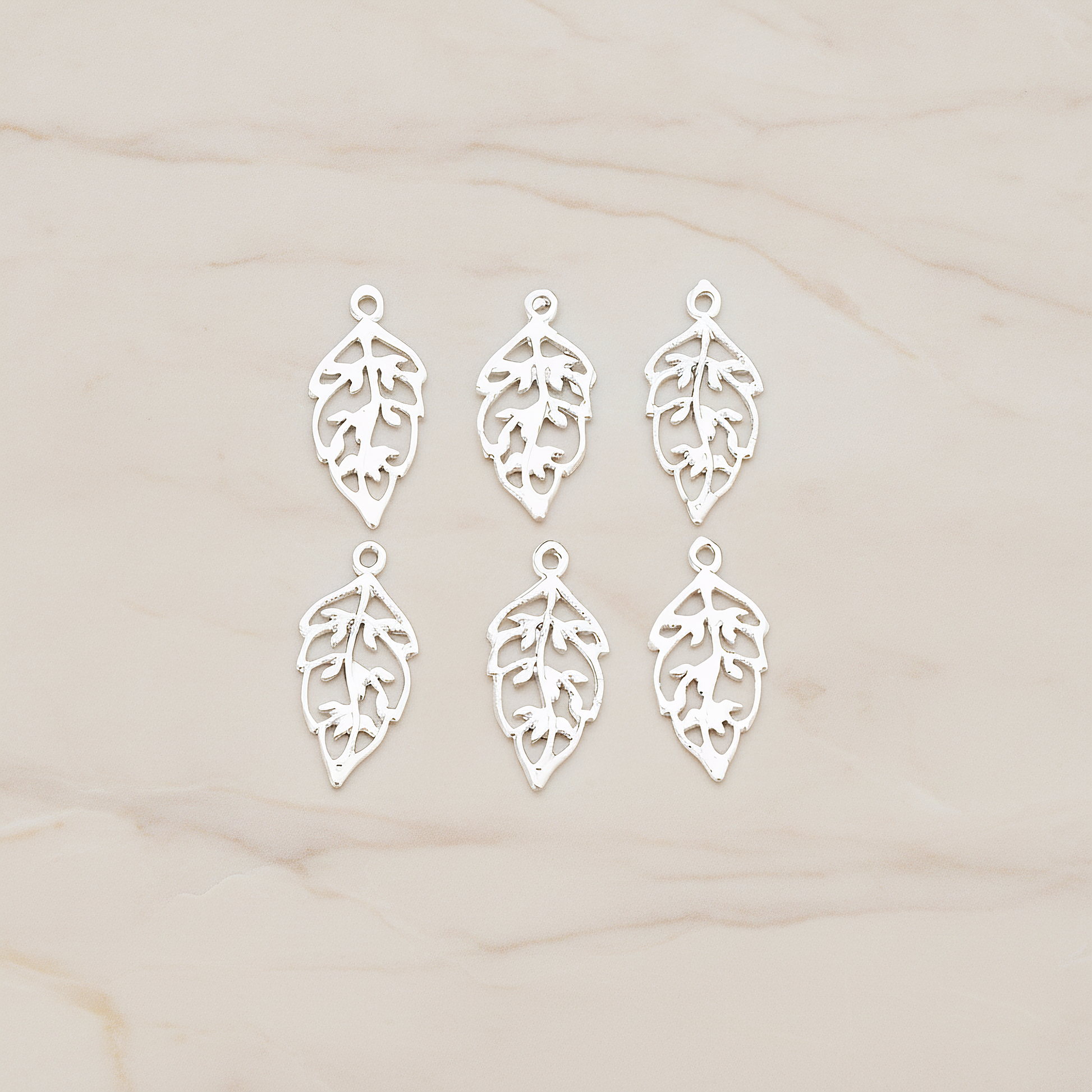 Unique Leaf Pendant, 4 Pc on warm marble background (PD.549)