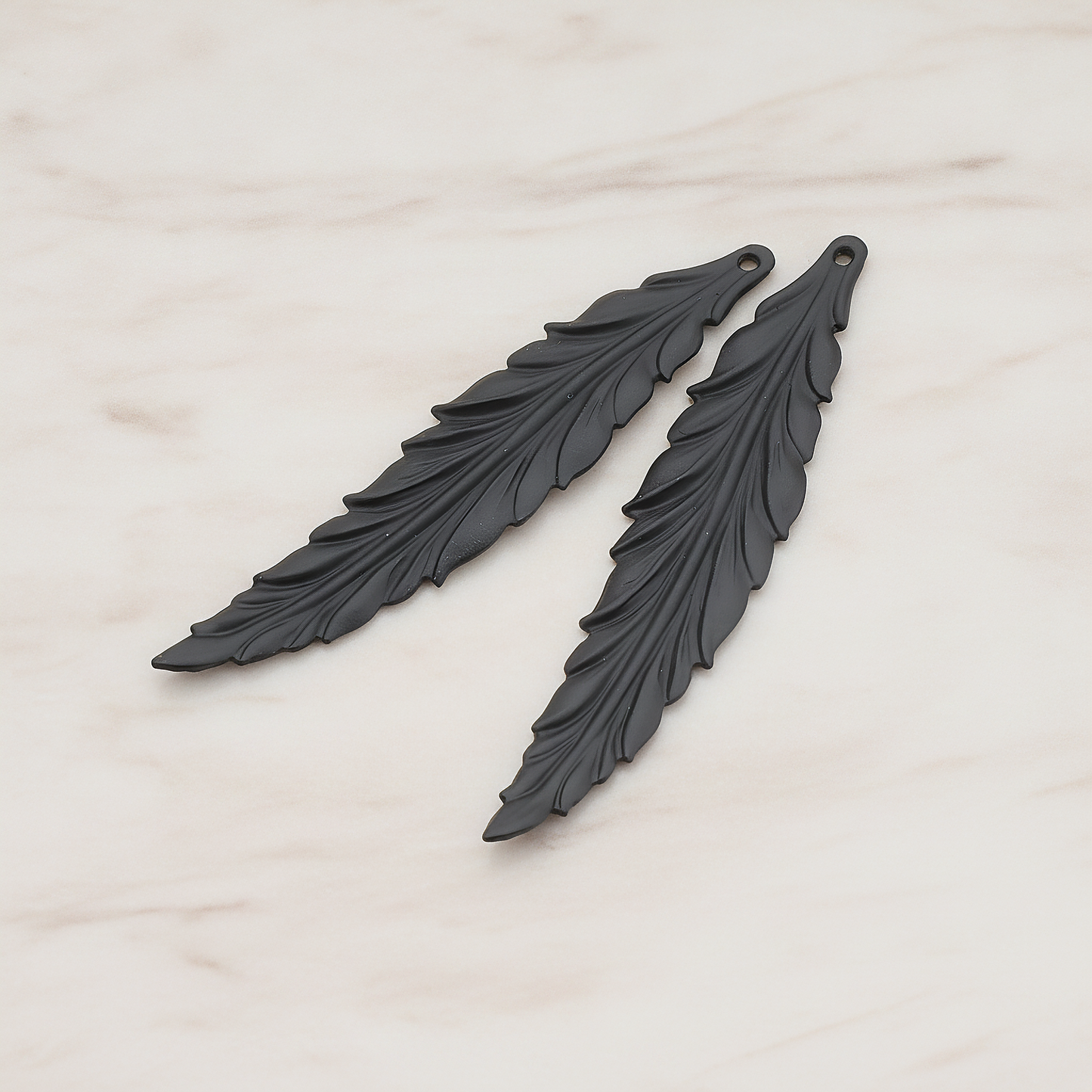 Thin Long Leaf Pendant, 2 Pc on warm marble background (PD.575-02)