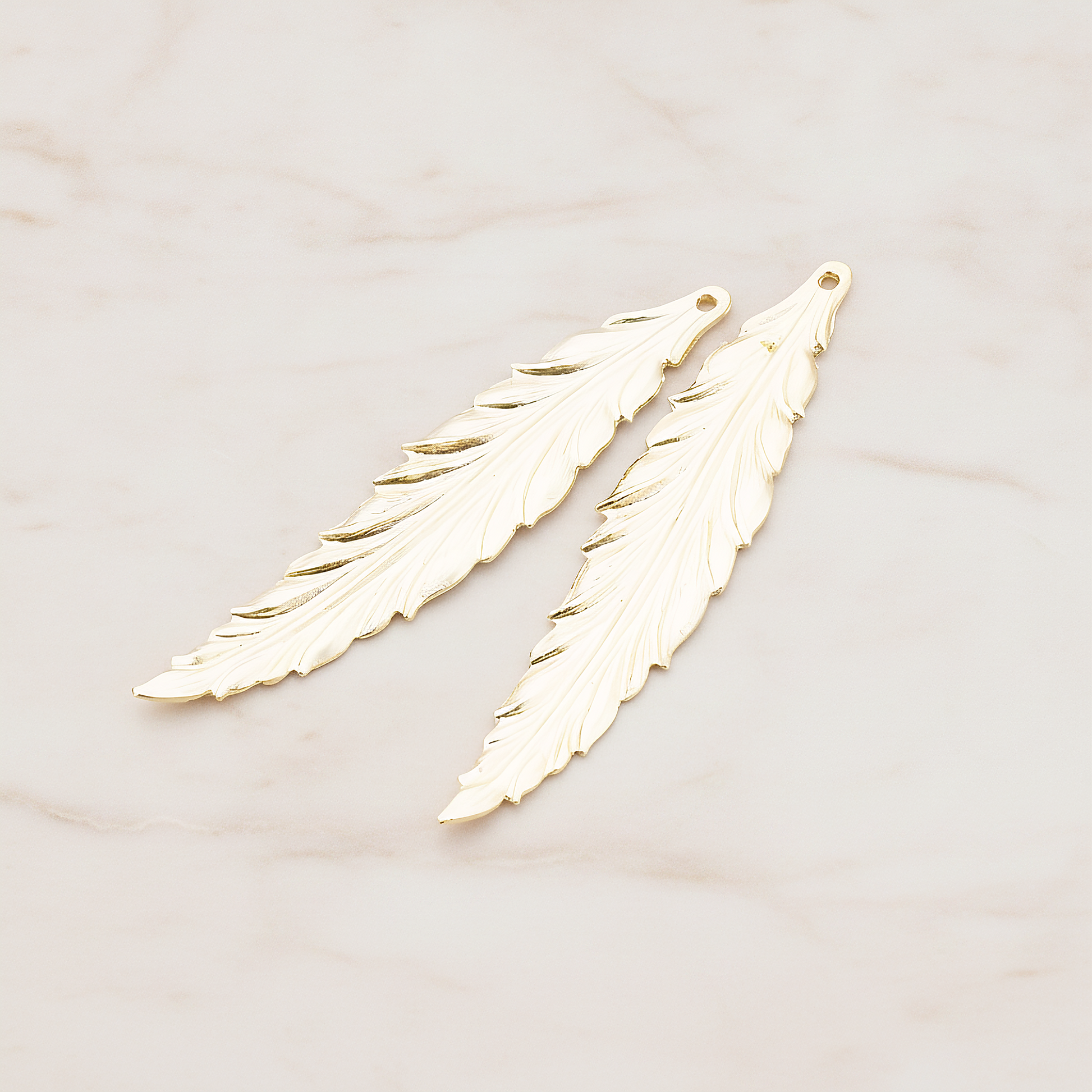 Thin Long Leaf Pendant, 2 Pc on warm marble background (PD.575-02)